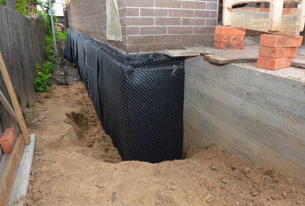 SJ Waterproofing Pros technician performing targeted Waterproofing assessment in Elwood, IN